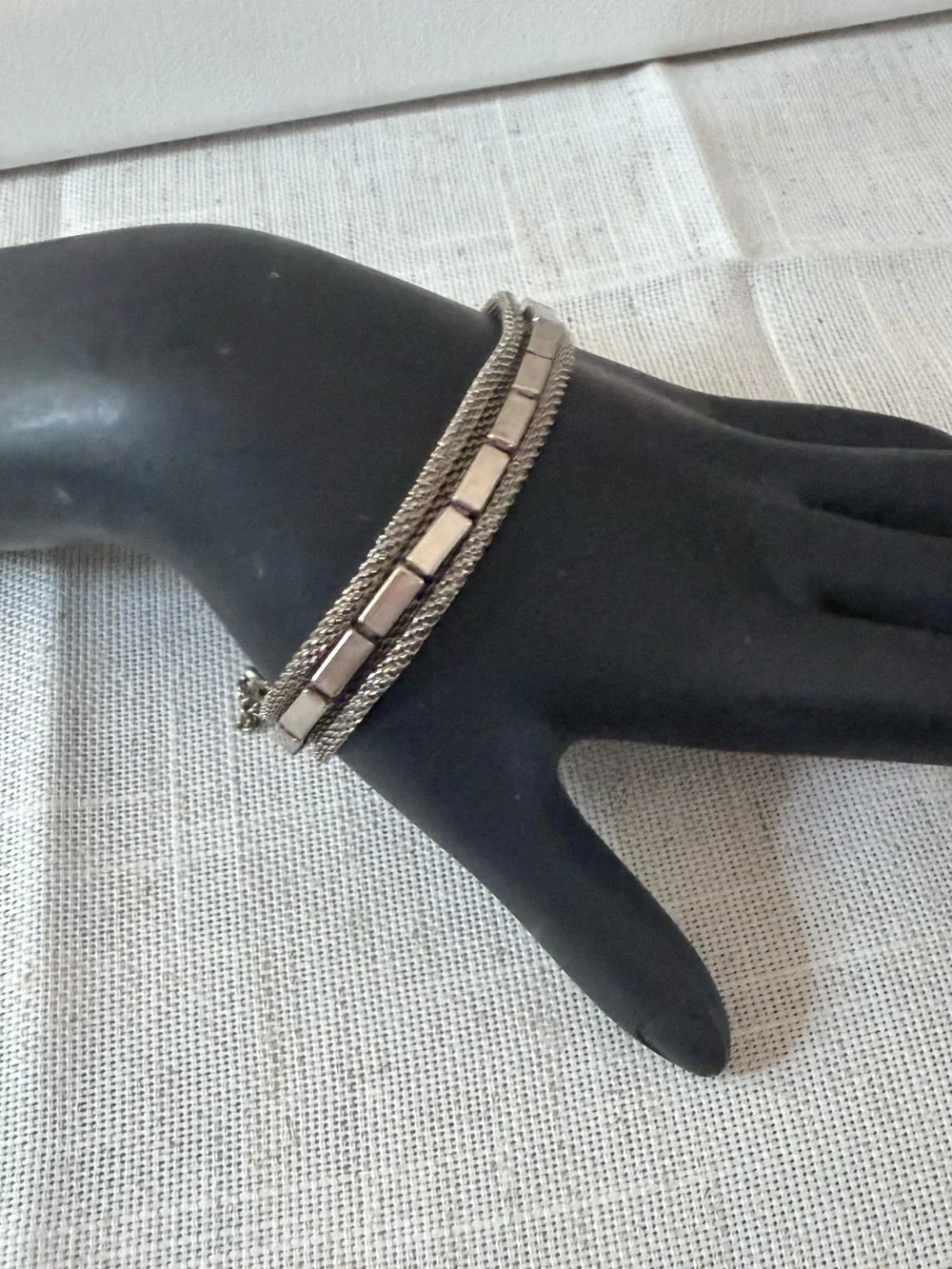 The image shows a vintage multi-strand silver-tone metal mesh bracelet